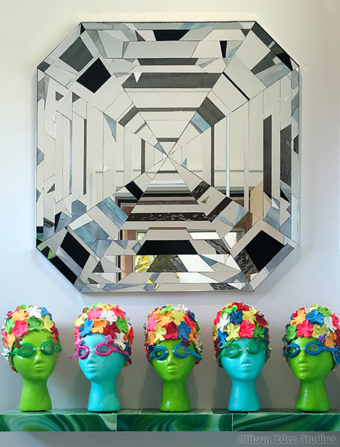 Custom hand-cut mirror diamond wall artwork displayed in a colorful contemporary interior