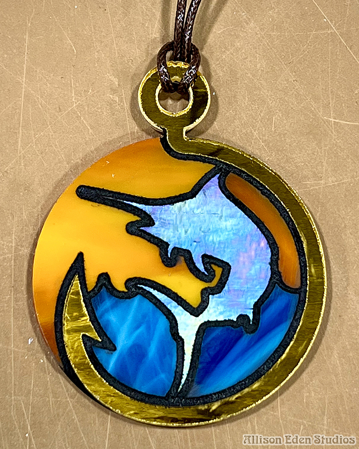 Swordfish stained glass fishing necklace with blue ocean orange sunset and gold hook frame