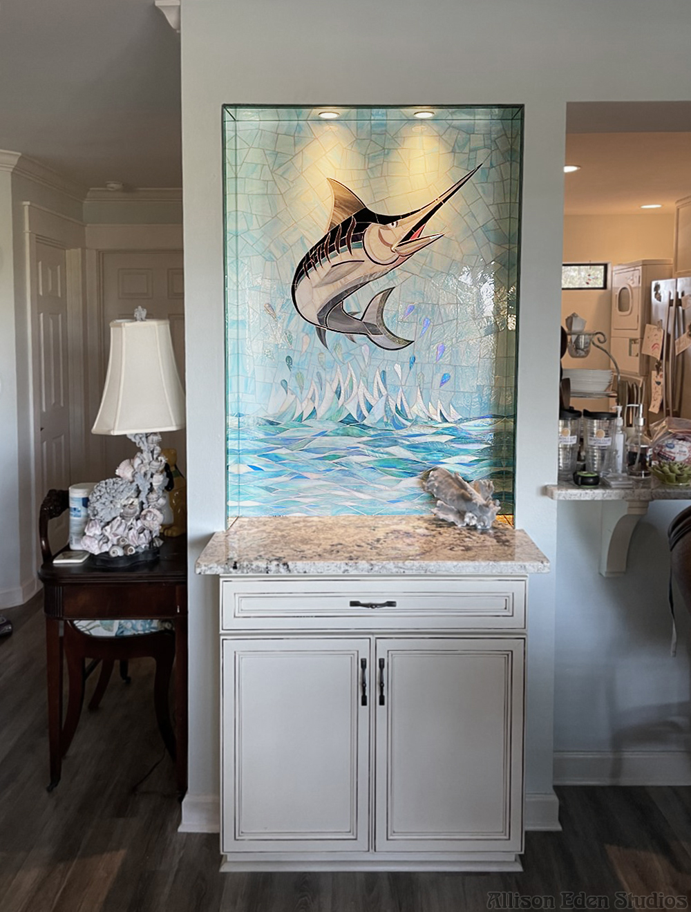 Custom swordfish glass mosaic installation by Allison Eden Studios in a coastal home interior