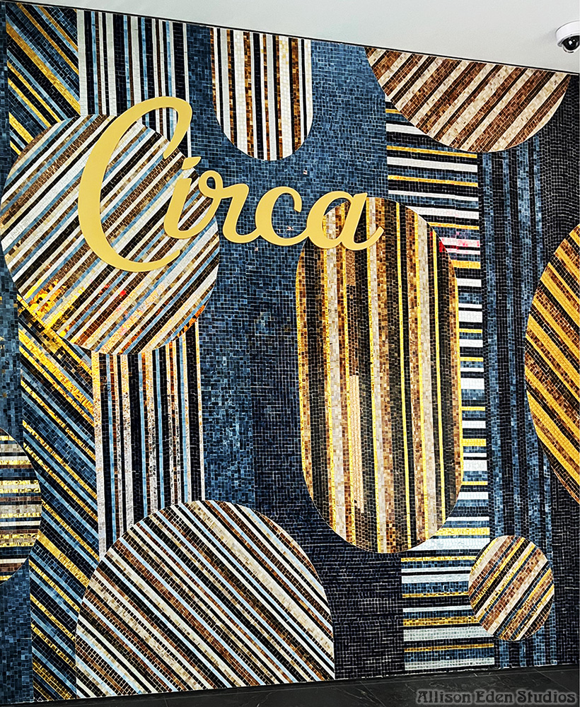 Custom commercial stained glass and mirror mosaic mural by Allison Eden Studios at the entrance of Circa Resort & Casino in Las Vegas featuring geometric Art Deco-inspired glass patterns.