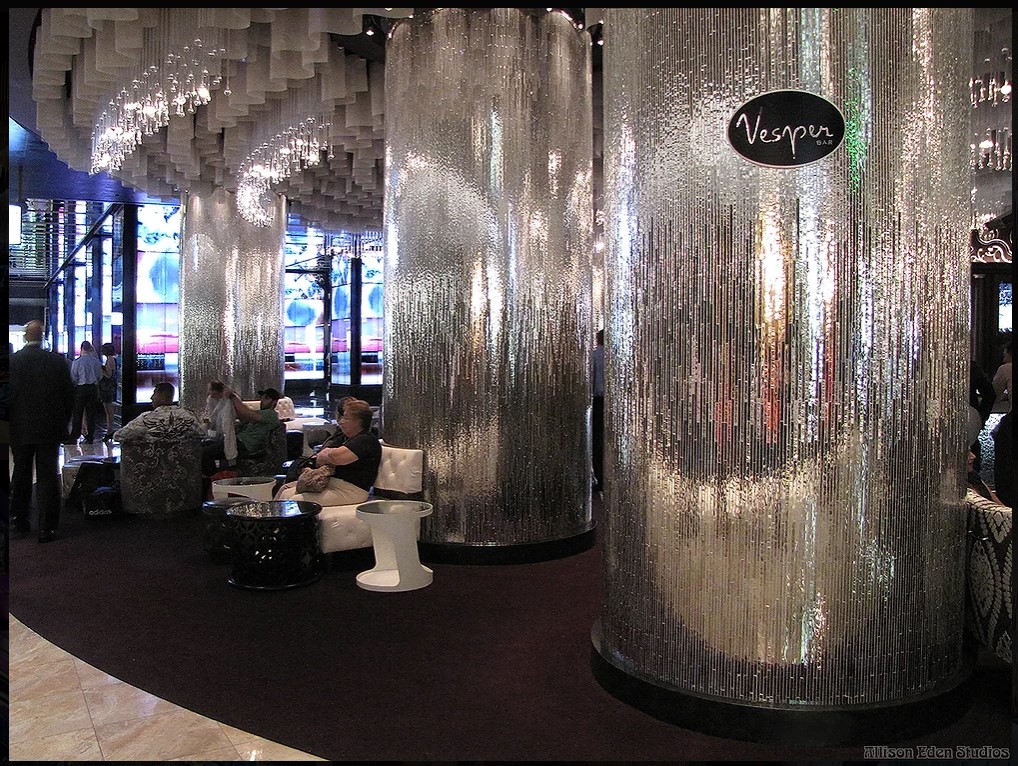 Custom handcrafted mirror mosaic columns by Allison Eden Studios at the Vesper Bar inside The Cosmopolitan Las Vegas featuring a three-tone linear mirror design for luxury hospitality interiors