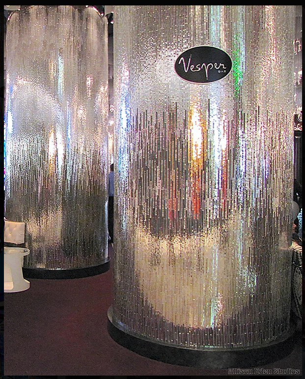 Custom handcrafted mirror mosaic columns by Allison Eden Studios at the Vesper Bar inside The Cosmopolitan Las Vegas featuring a three-tone linear mirror design for luxury hospitality interiors