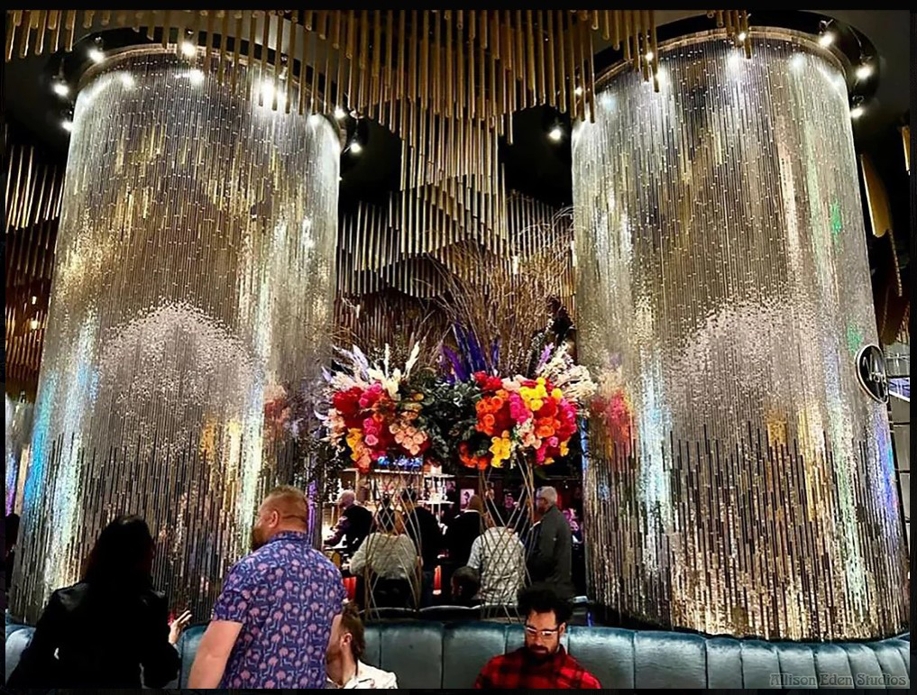 Custom handcrafted mirror mosaic columns by Allison Eden Studios at the Vesper Bar inside The Cosmopolitan Las Vegas featuring a three-tone linear mirror design for luxury hospitality interiors