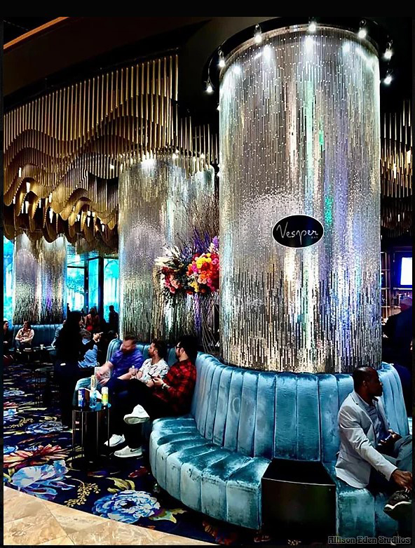 Custom handcrafted mirror mosaic columns by Allison Eden Studios at the Vesper Bar inside The Cosmopolitan Las Vegas featuring a three-tone linear mirror design for luxury hospitality interiors