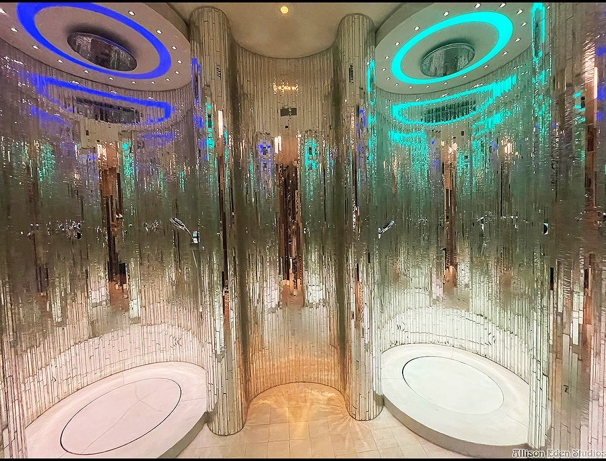 Custom handcrafted vertical mirror mosaic walls by Allison Eden Studios installed in a luxury spa in Nassau, Bahamas featuring curved architectural surfaces and shimmering reflective glass.