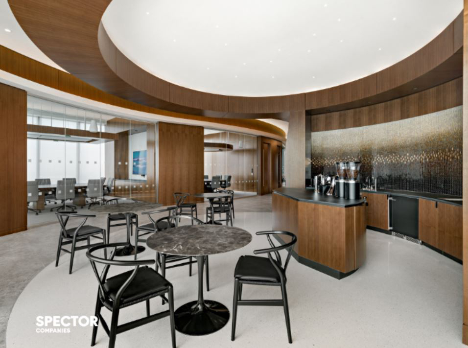 Cream, bronze, chocolate and black glass mosaic gradation wall in One Vanderbilt workplace coffee bar.
