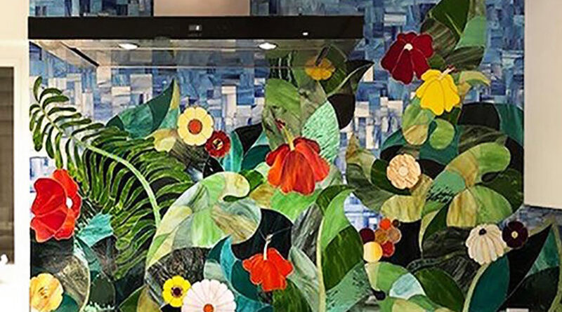 Custom tropical floral stained glass mosaic kitchen backsplash by Allison Eden Studios featuring hibiscus flowers, palm leaves and lush green foliage.
