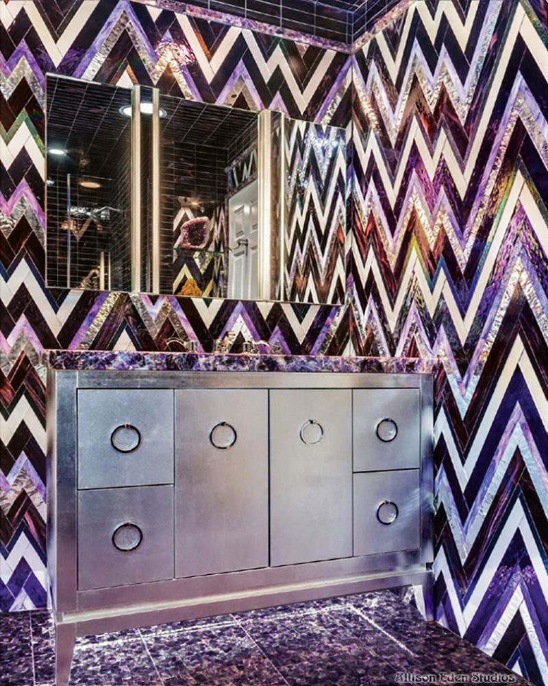 Luxury powder room featuring Allison Eden Studios Extreme ZigZag custom glass and mirror mosaic tile in violet, purple, black and white.