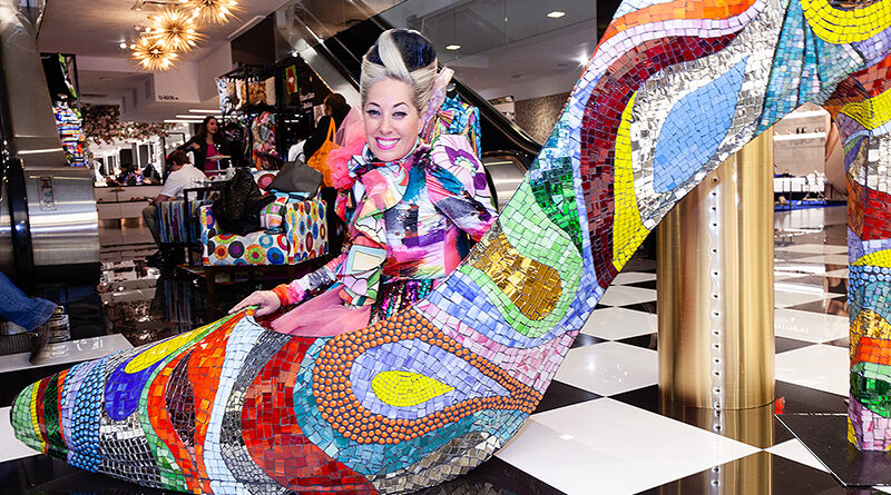 Mosaic High Heeled Shoe Sculpture at Bloomingdales Allison Eden pop up shop with Allison Eden sitting inside giant shoe.