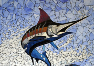 Handcrafted marine life mosaic by Allison Eden Studios featuring a leaping billfish and shark created from hundreds of individually cut pieces of stained glass.