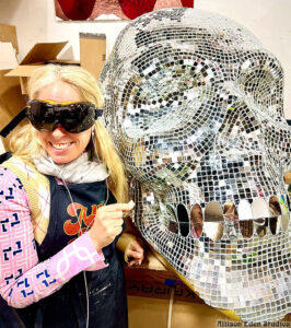 Large handcrafted mirror mosaic skull sculpture by Allison Eden Studios created for Pink Taco NYC, featuring thousands of hand-cut mirror glass tiles that reflect light like a giant disco ball.