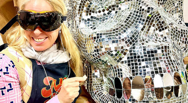 Large handcrafted mirror mosaic skull sculpture by Allison Eden Studios created for Pink Taco NYC, featuring thousands of hand-cut mirror glass tiles that reflect light like a giant disco ball.