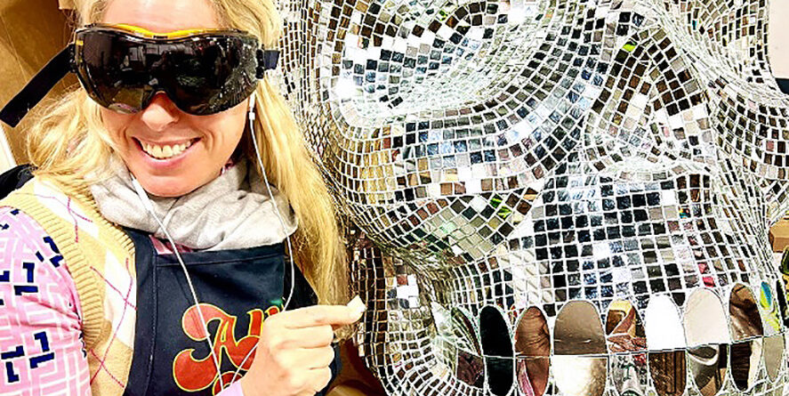 Large handcrafted mirror mosaic skull sculpture by Allison Eden Studios created for Pink Taco NYC, featuring thousands of hand-cut mirror glass tiles that reflect light like a giant disco ball.