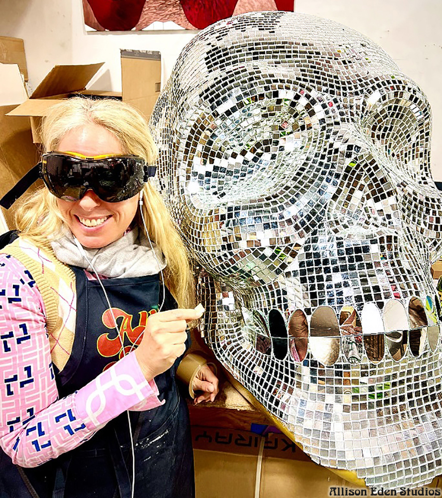 Large handcrafted mirror mosaic skull sculpture by Allison Eden Studios created for Pink Taco NYC, featuring thousands of hand-cut mirror glass tiles that reflect light like a giant disco ball.