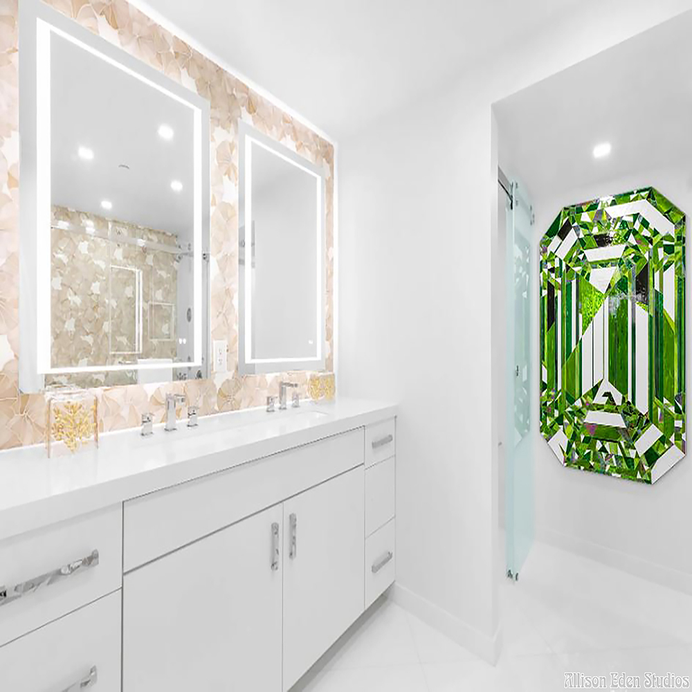 Emerald green stained glass gemstone artwork by Allison Eden Studios installed as statement art in a luxury white bathroom.