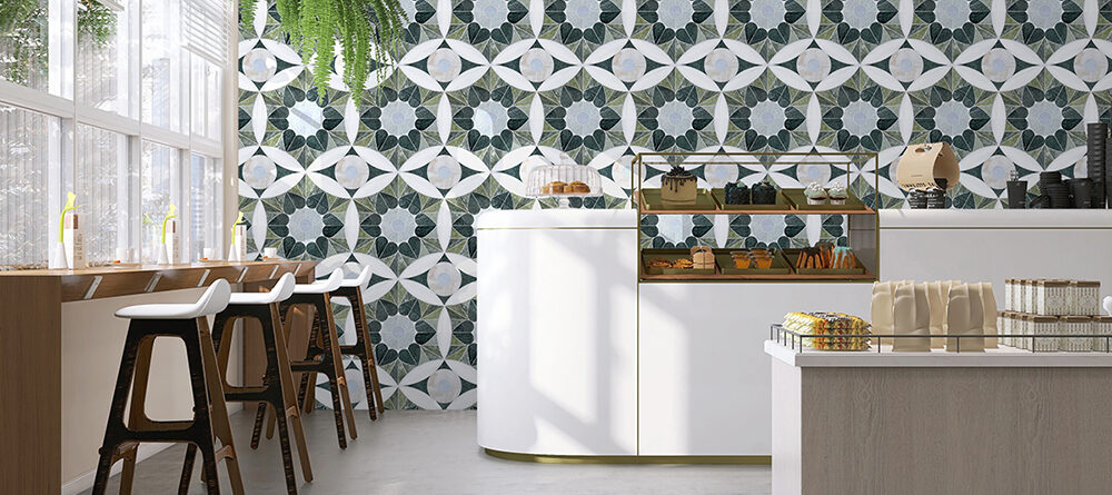 Green Moroccan Love stone mosaic feature wall by Allison Eden Studios in a contemporary café interior.