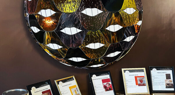 SMILE Fun Ball stained glass and mirror mosaic artwork by Allison Eden Studios featuring gold, chocolate, lavender, and amber glass inspired by Sherwin-Williams color palettes.