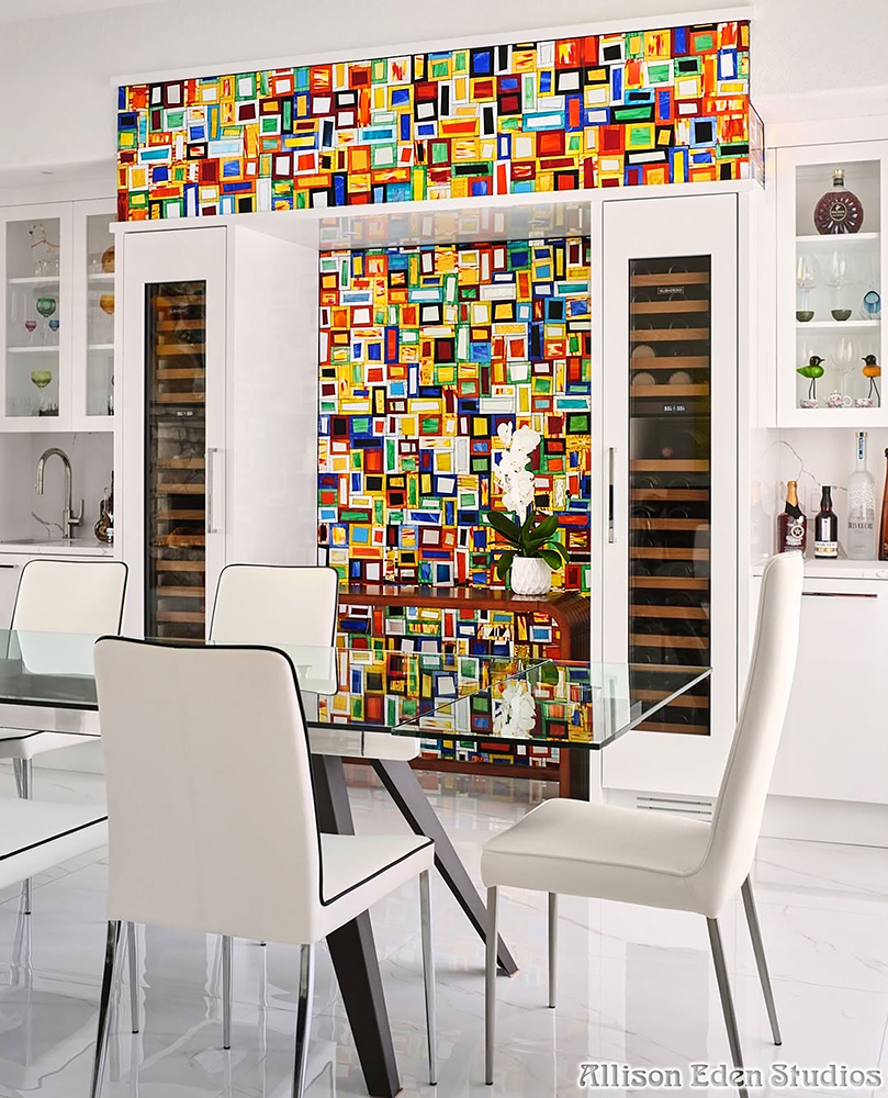 Handcrafted Tiki Blocks™ stained glass mosaic feature wall by Allison Eden Studios surrounding a custom wine room, adding bold color and artistic impact to a luxury modern home.