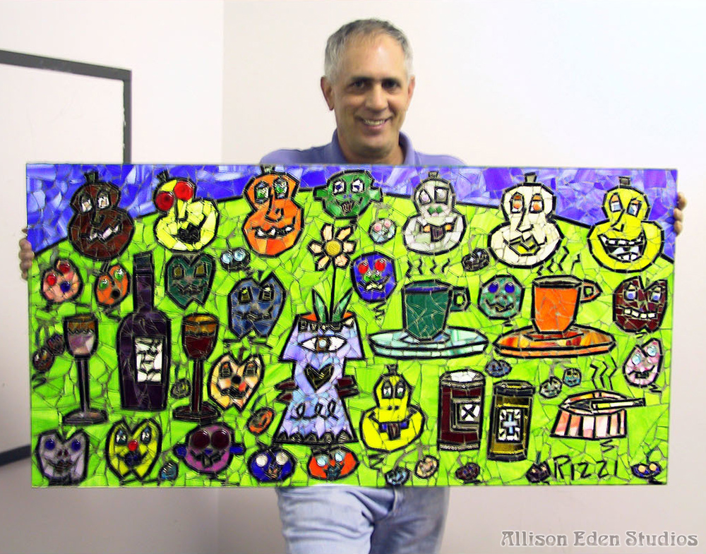 Collaborative Artwork with James Rizzi holding mosaic art