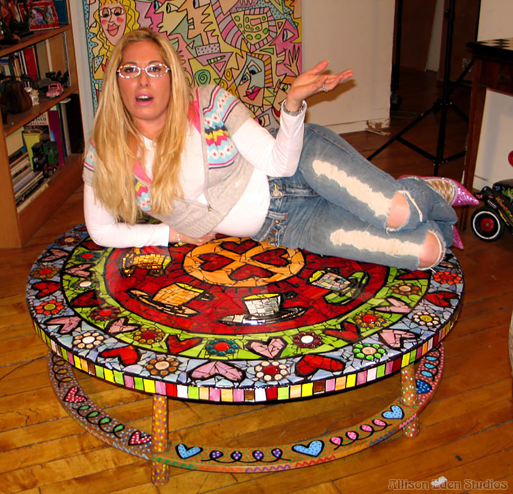 Allison Eden at James Rizzis House with mosaic table Collaborative Artwork with James Rizzi