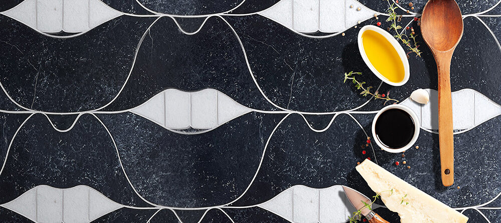 Black and white SMILE Lips natural stone mosaic tile by Allison Eden Studios styled for a luxury kitchen backsplash.