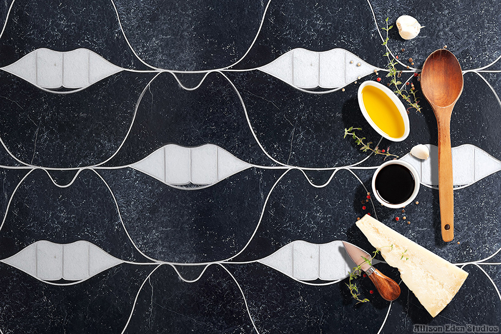 Black and white SMILE Lips natural stone mosaic tile by Allison Eden Studios styled for a luxury kitchen backsplash.