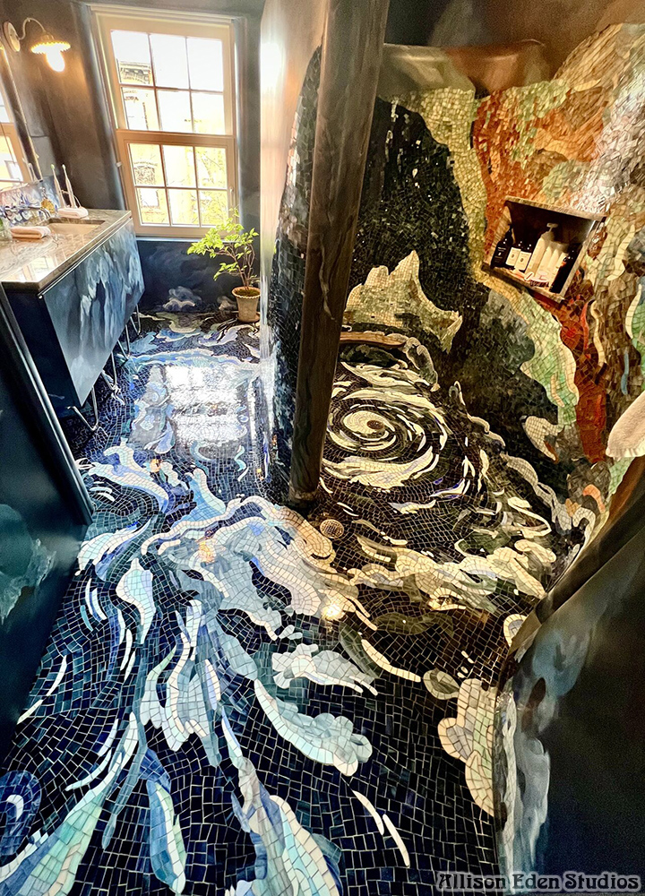Floor-to-ceiling custom glass mosaic bathroom by Allison Eden Studios featuring dramatic ocean waves, a Titanic-inspired shower, handcrafted stained glass walls, and an immersive luxury spa design.