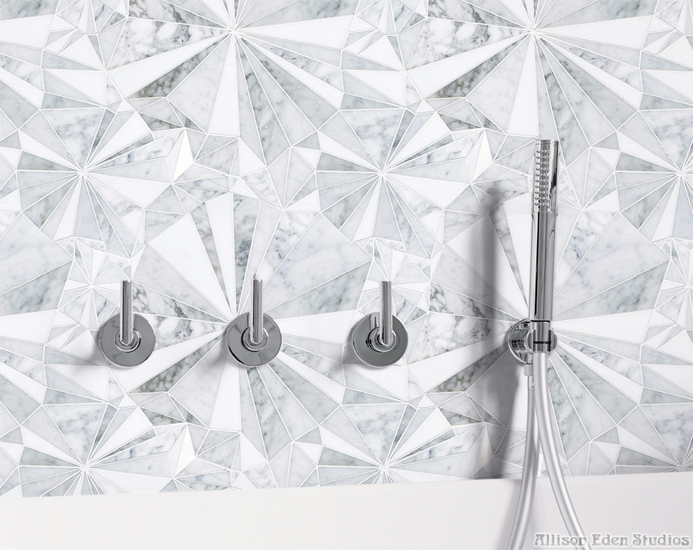 Luxury shower wall featuring Allison Eden Studios Starburst white and grey geometric marble mosaic with chrome fixtures