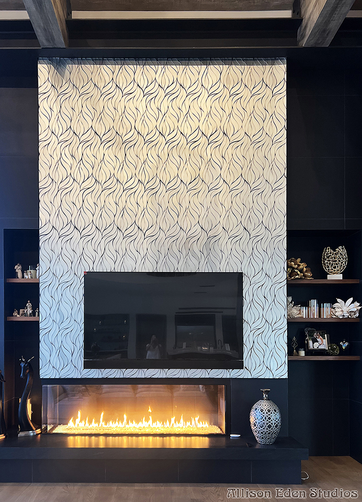 Contemporary white and brushed mirror wave mosaic fireplace feature wall with television