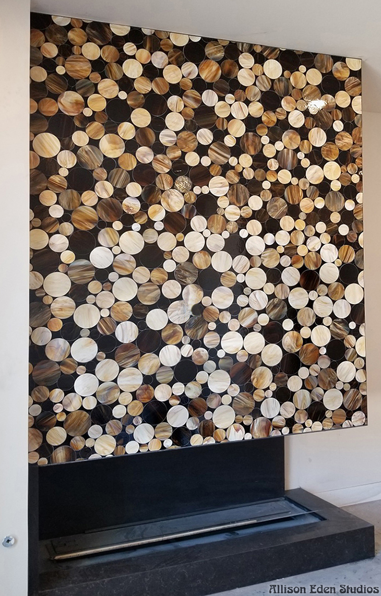 Brown cream and ivory circular glass mosaic fireplace feature wall by Allison Eden Studios