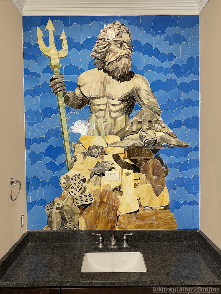 Custom Neptune stained glass mosaic mural installed above a vanity in a coastal powder room.