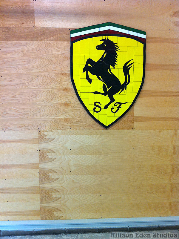 Handcrafted yellow and black Ferrari-inspired prancing horse stained glass mosaic artwork created by Allison Eden Studios