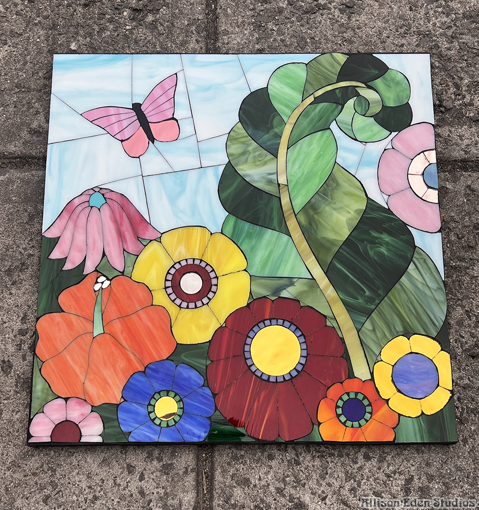 Allison Eden Studios stained glass and mirror mosaic Floral with butterfly artwork on sidewalk 24 X 24