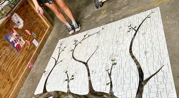 Allison Eden with Cherry Blossom Mosaic Tile artwork in progress at Allison Eden Studios
