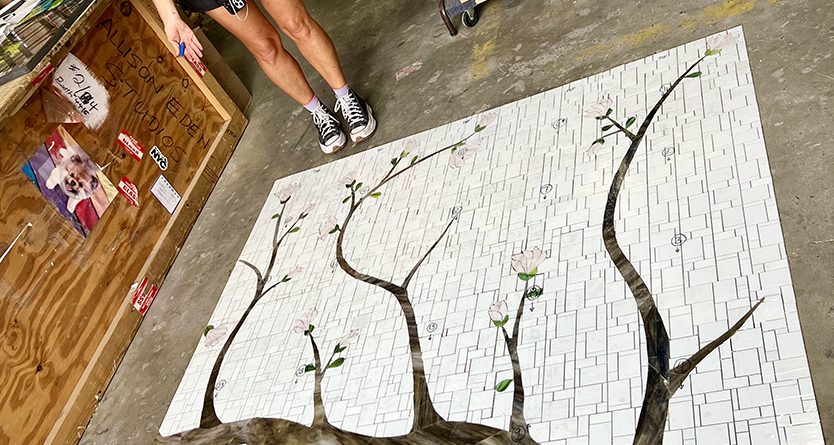 Allison Eden with Cherry Blossom Mosaic Tile artwork in progress at Allison Eden Studios