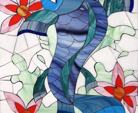 Fish or Die by Allison Eden, a handcrafted stained glass mosaic of a blue koi fish surrounded by orange hibiscus flowers with a tattoo-style banner.