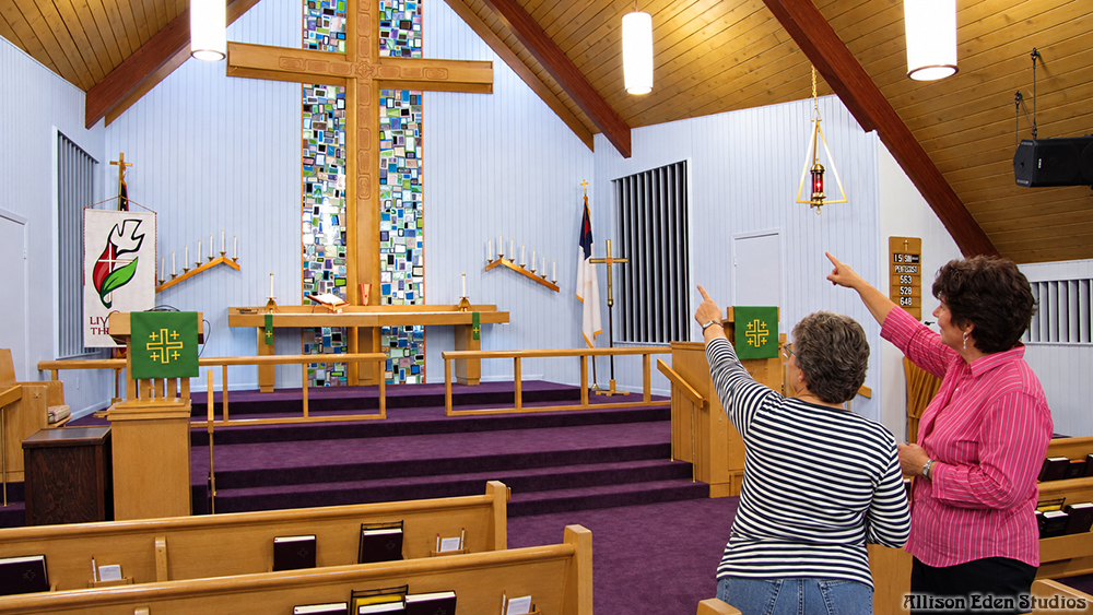 Custom stained glass mosaic installation framing the cross in a Pennsylvania church sanctuary by Allison Eden Studios.